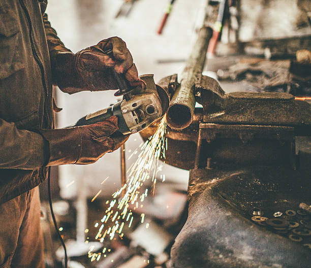 Man grinding metal Man grinding metal oxyacetylene stock pictures, royalty-free photos & images