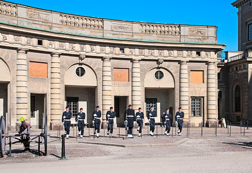 Stockholm, Sweden – April 14, 2010: Changing of the Guards Soldiers at Royal Palace. The Royal Guards has been stationed at the Royal Palace since 1523 and is a popular tourist attraction
