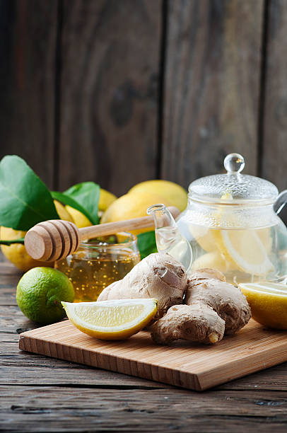 istock Cocktail with ginger, lemon and honey on the wooden table 511102578