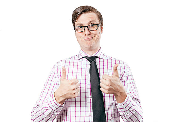 Happy smiling geek isolated on white with two thumbs up Happy smiling geek isolated on white with two thumbs up. He's wearing a tie and striped shirt. comb over stock pictures, royalty-free photos & images