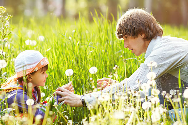 istock father and daughter for a walk summer day 511103820