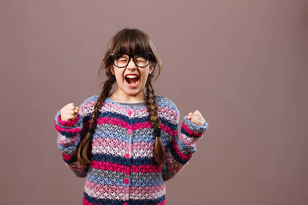 istock Angry little nerdy girl 511106228