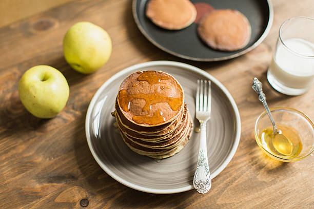 istock Delicious pancakes close up, with honey, top view 511106380