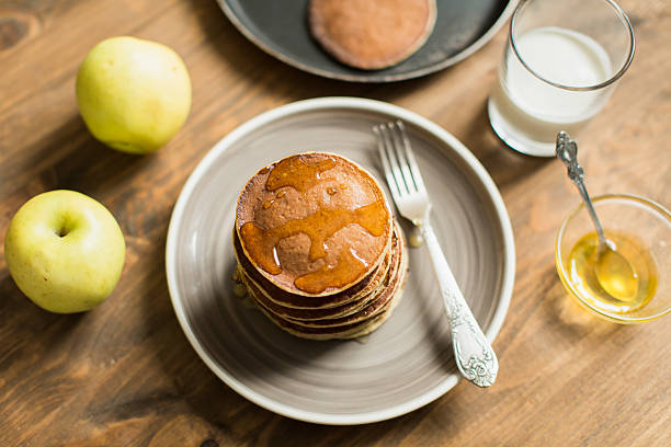 istock Delicious pancakes close up, with honey, top view 511106516