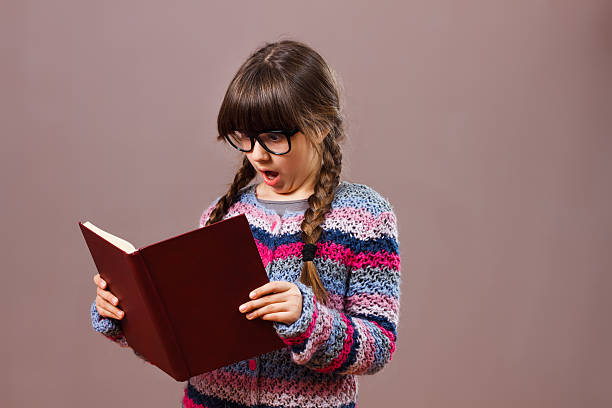 istock Surprised little nerdy girl 511106628