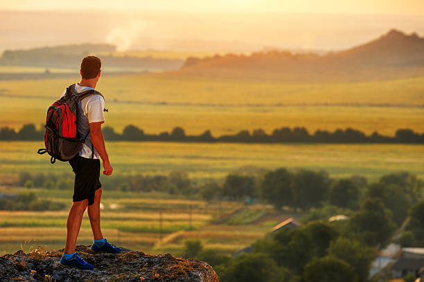 istock Hiker with backpack standing on top of a mountain 511107146