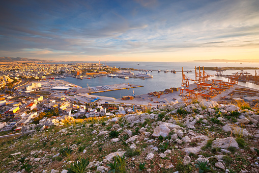 Athens, Greece - December 01, 2015: View of container port in Piraeus, Athens. Image shows pier one in the foreground and car terminal on the left.
