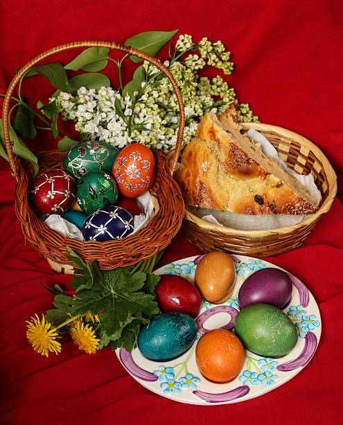 Easter eggs, cake and flowers - red background