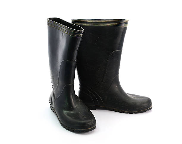 istock dirty black rubber boots isolated on white background 511110126