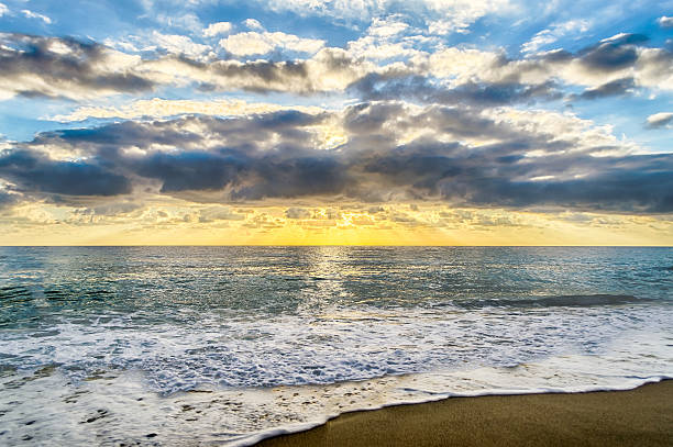 istock Sunset on the sea with a scenic cloudy sky 511110924