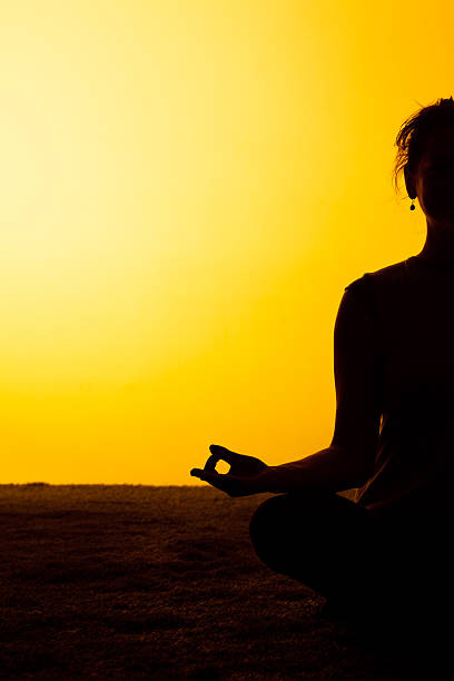 istock The woman practicing yoga in the sunset light 511111482