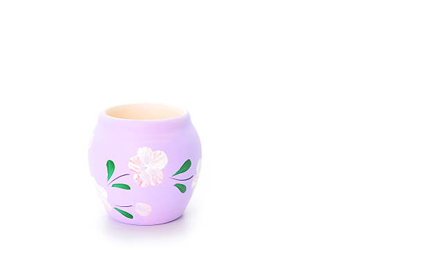 Colored jar painted with flowers on white background