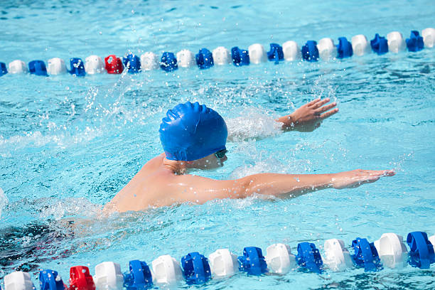 istock Young Teenage Boy Swimming Butterfly Stroke 511112840