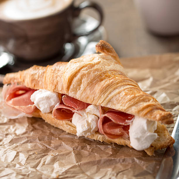 istock Croissant sandwich with ham and cream cheese 511113362