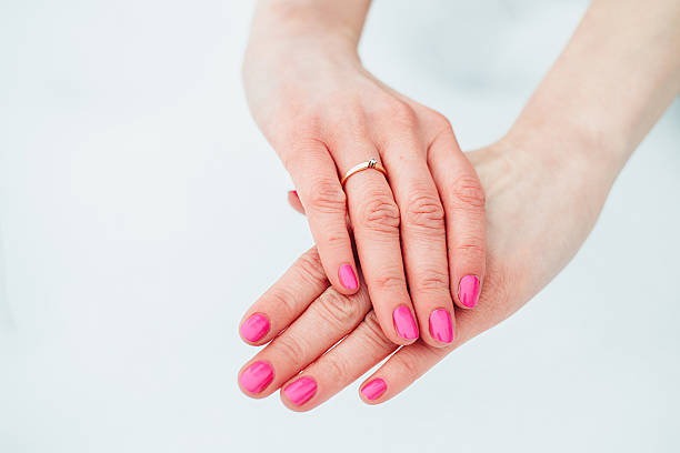 istock girl's hand with ring on a simple background 511114280