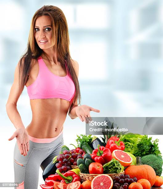 Young Woman With Variety Of Organic Vegetables And Fruits Stock Photo - Download Image Now