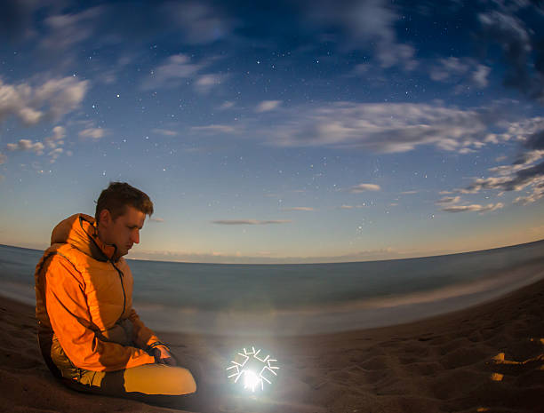 istock Hiking tourist have a rest in his camp at night 511120360