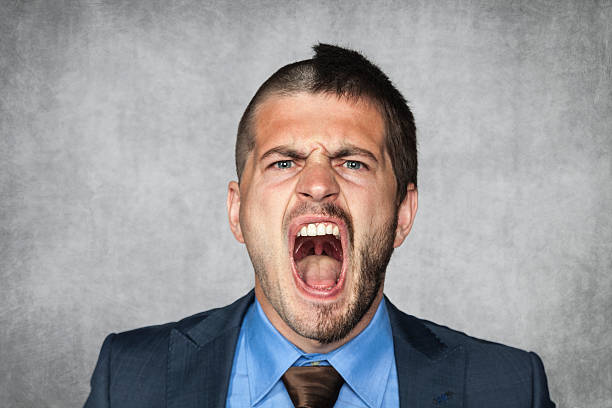 istock angry businessman screaming, funny haircut 511131555