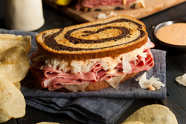 Homemade Reuben Sandwich Homemade Reuben Sandwich with Corned Beef and Sauerkraut reuben sandwich stock pictures, royalty-free photos & images