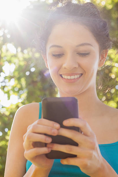 istock Content young woman dialing with her smartphone 511131621