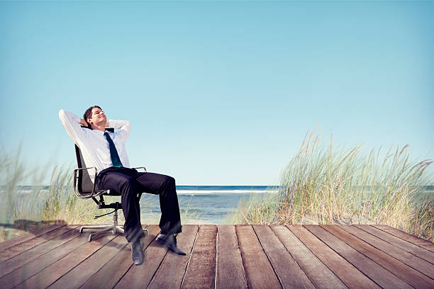 istock Businessman Relaxing on Office Chair at Beach 511132429