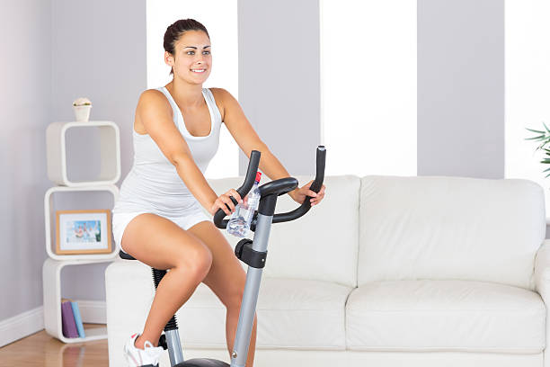 istock Beautiful fit woman training on an exercise bike 511133113