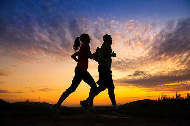 istock Silhouette of couple running 511135767