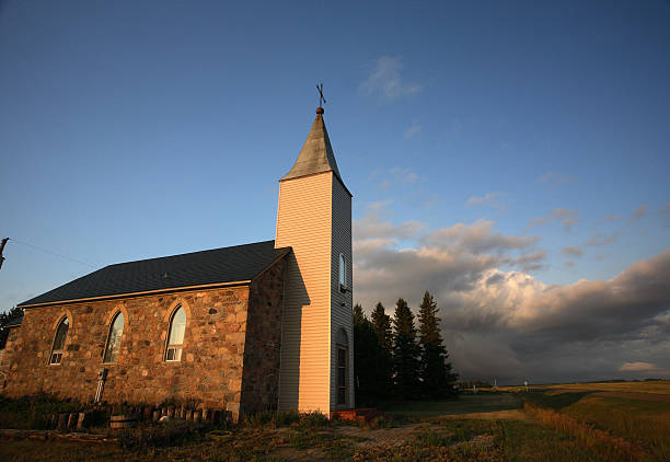 istock Thunderhead clouds forming behind a country church 511137347