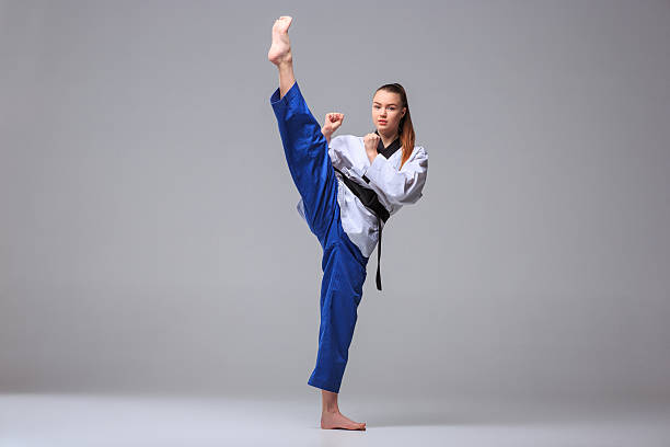 istock The karate girl with black belt 511190116