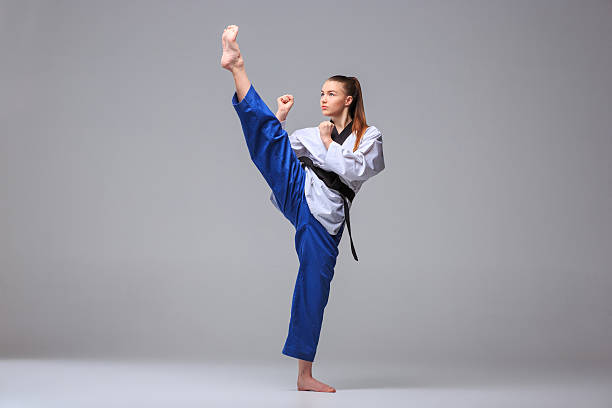 istock The karate girl with black belt 511190256