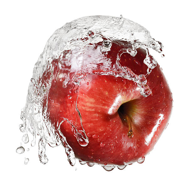 istock Red apple in splash of water 511190706