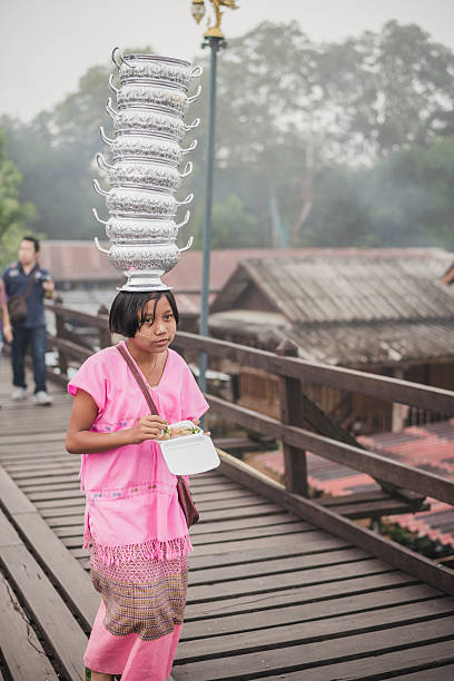 Asian kids with art painted with powde in Sangkhlaburi.  Kanchanaburi,Thailand-December 12, 2015: Asian kids with art painted with powder on Mon village and the longest wooden bridge in Sangkhlaburi, Thailand. sangkhla stock pictures, royalty-free photos & images