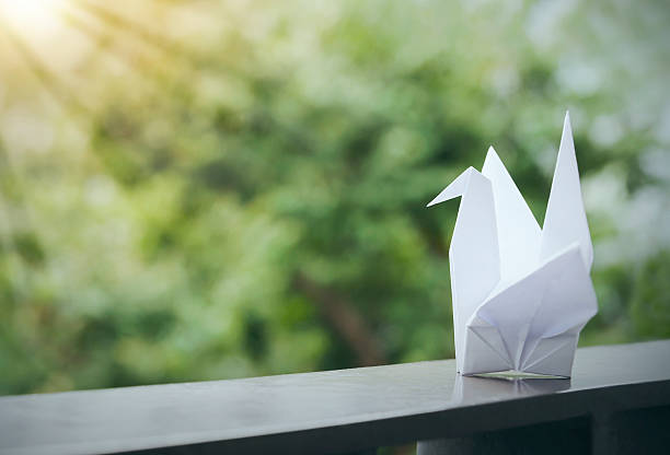 Vintage origami paper crane on the balcony