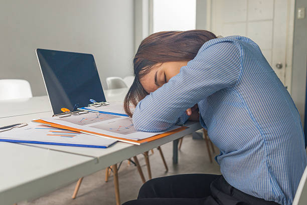 istock Asian office employee sleeping in her room at lunch time 511194138