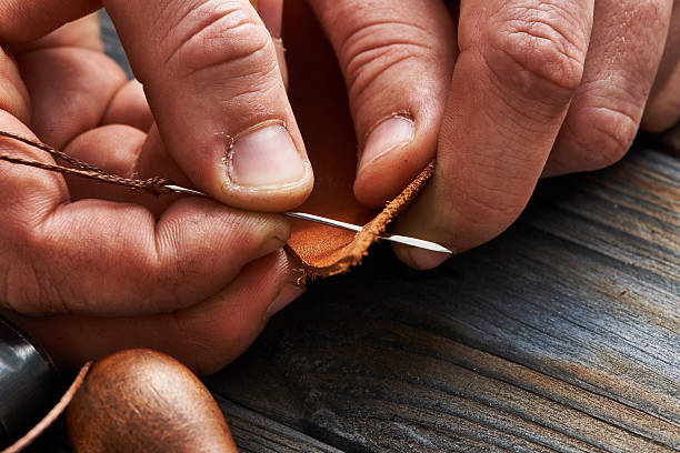 Man working with leather stock photo