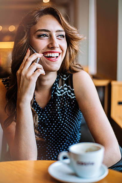 istock Smiling young woman on the phone 511195394