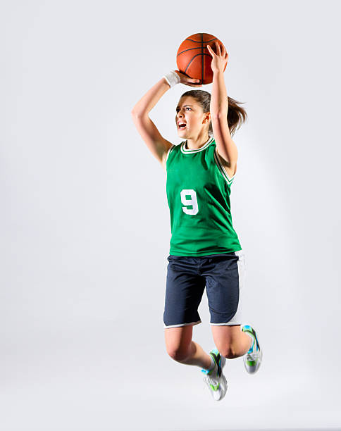 istock Young girl basketball player 511197096