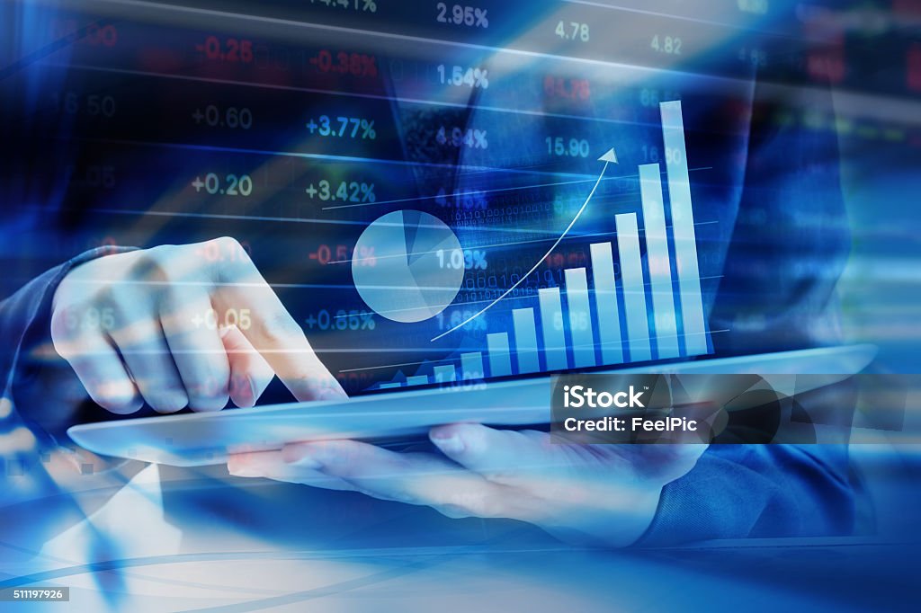 Business woman are checking stock market Business woman are checking stock market graph on digital tablet Change Stock Photo