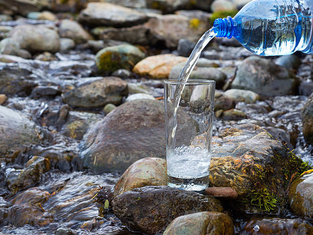 istock Natural drinking water is being poured into glass 511197934