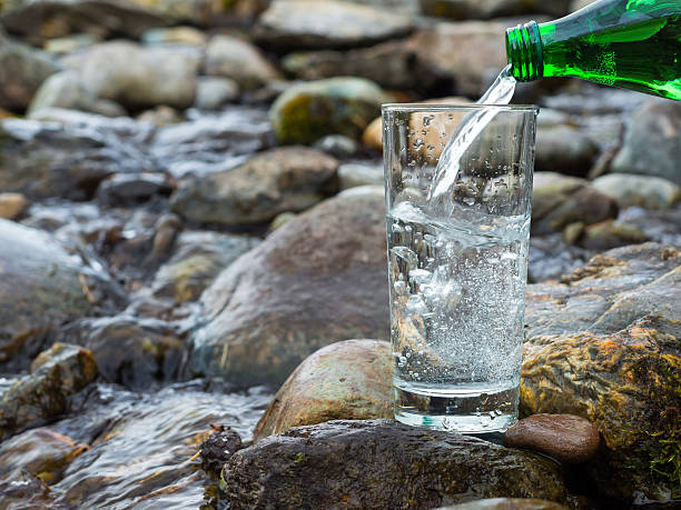 istock Natural drinking water is being poured into glass 511198086