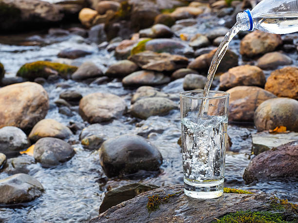 istock Natural drinking water is being poured into glass 511198252