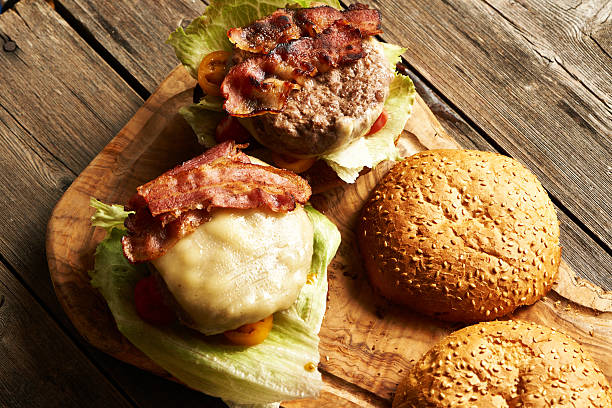 istock Home made cheeseburgers on wooden table 511199314