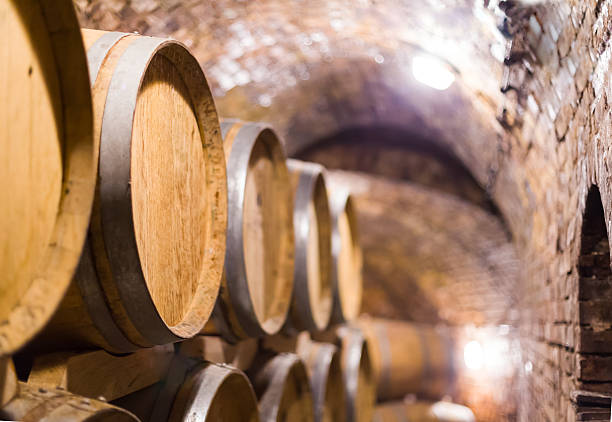 istock Wooden barrels containing wine in the cellar 511199610
