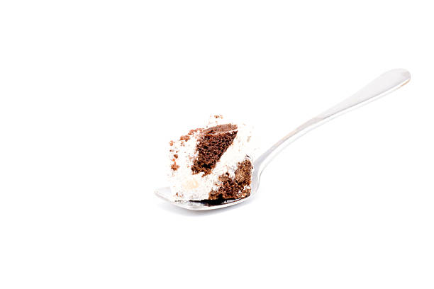 istock Piece of cake on a spoon isolated 511199806