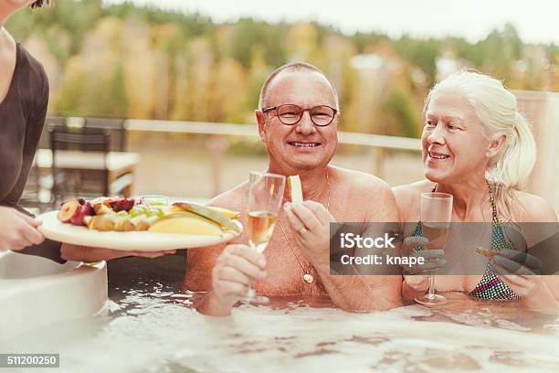 Real People At Outdoors Spa In Tub Stock Photo - Download Image Now - 50-59 Years, 60-69 Years, Active Lifestyle