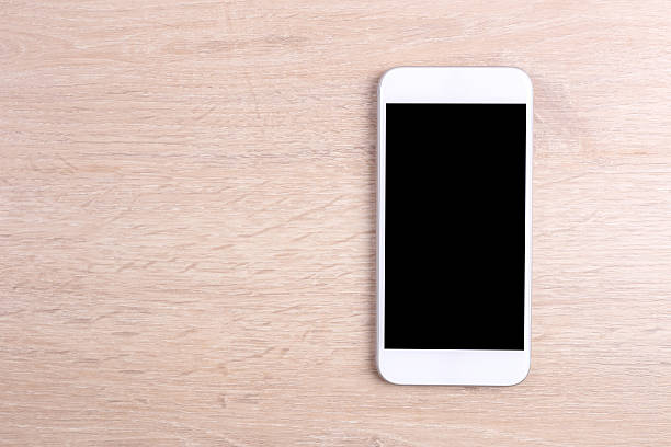 istock Blank screen smartphone on wooden background 511202238