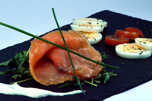 A slice of salmon smokes.