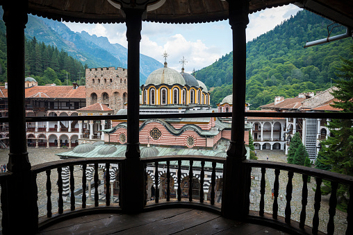 Rila, Bulgaria - August 24, 2013: Late afternoon scene inside Rila Monastery. The largest and most famous Eastern Orthodox monastery in Bulgaria, it is situated in the southwestern Rila Mountains, 117 km (73 mi) south of the capital Sofia at an elevation of 1,147 m (3,763 ft) above sea level. It was founded in the 10th century.