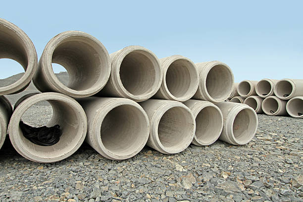 istock Stacked Concrete Culverts On New Road Construction Site 511206648