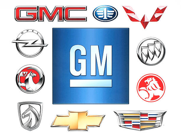 Marcas de Geral Motores empresa impressas em papel. - fotografia de stock